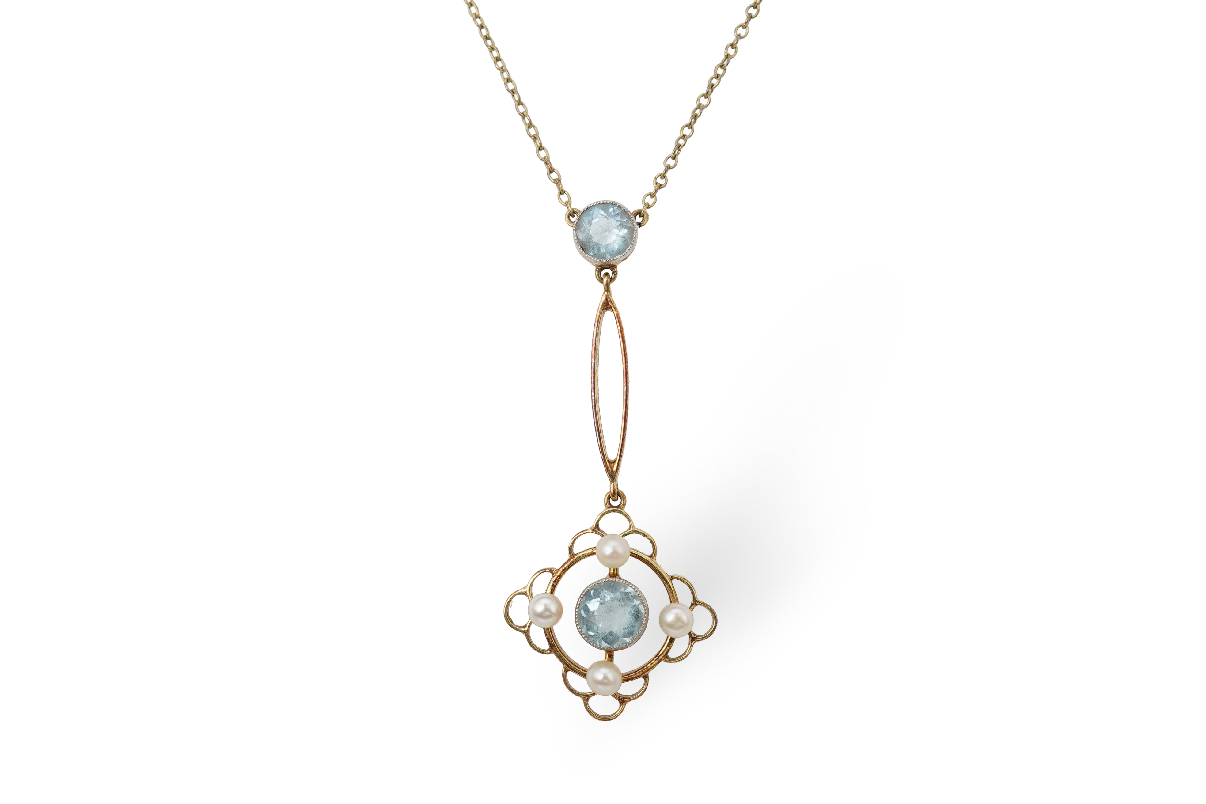 An Edwardian circular-cut aquamarine and seed pearl pendant, early 20th century, of foliate design, mounted in gold, pendant length 4cm, chain length 40cm, clasp stamped 15, gross weight approximately 3 grams, pearls unt